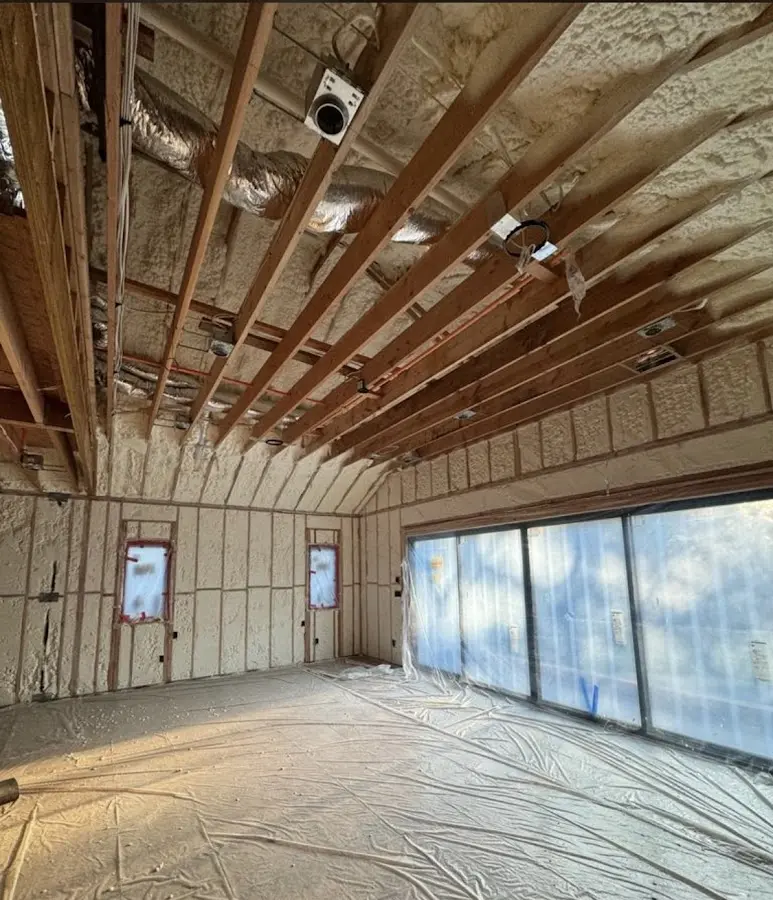 Interior walls and ceiling insulated with spray foam during new construction in Newtown